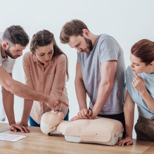 Group practising CPR on a training manikin during a Hayes First Aid CFR Community First Responder course